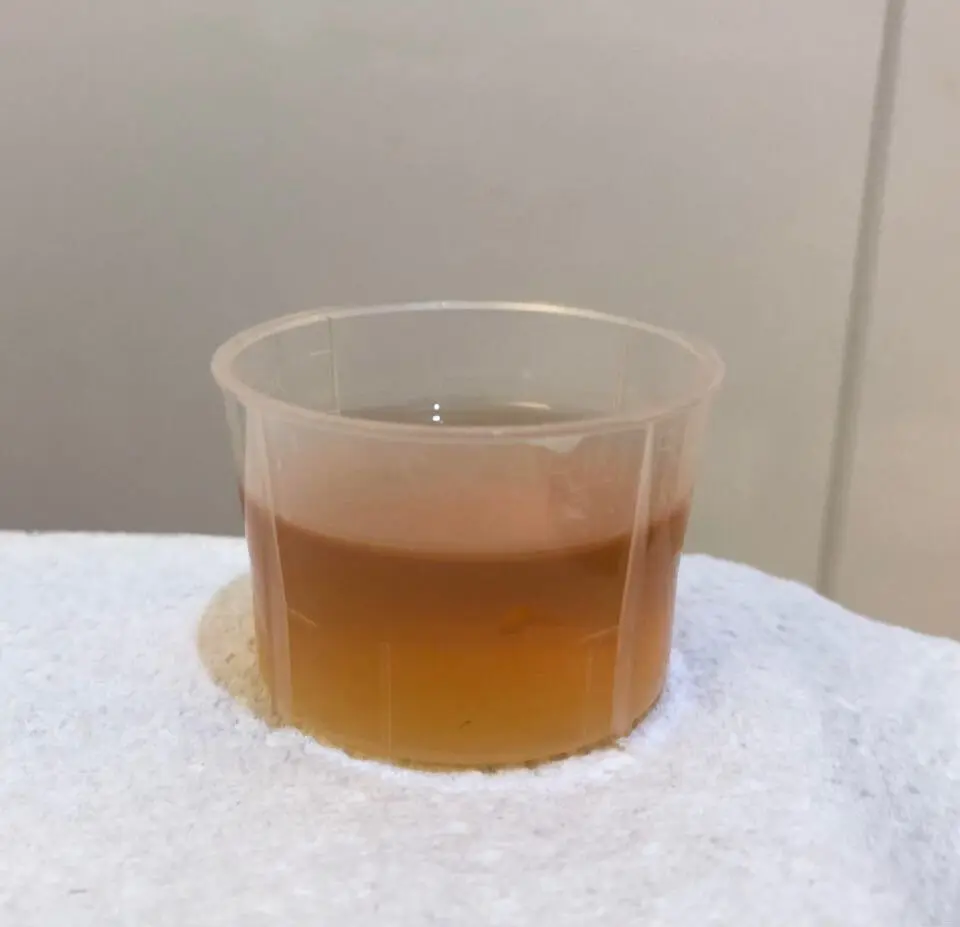 Cough medicine in a medicine measure cup